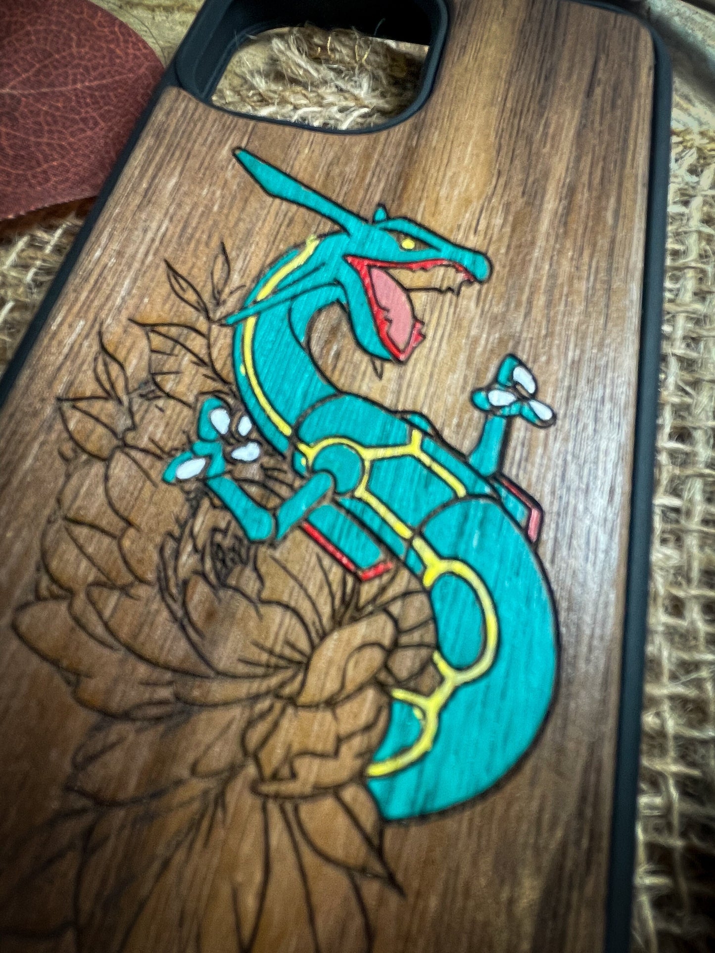 a wooden case with a lizard on it