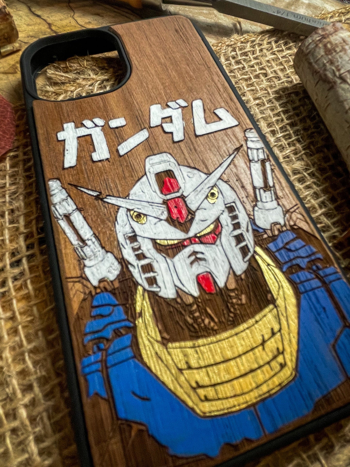 a wooden phone case with a picture of a samurai