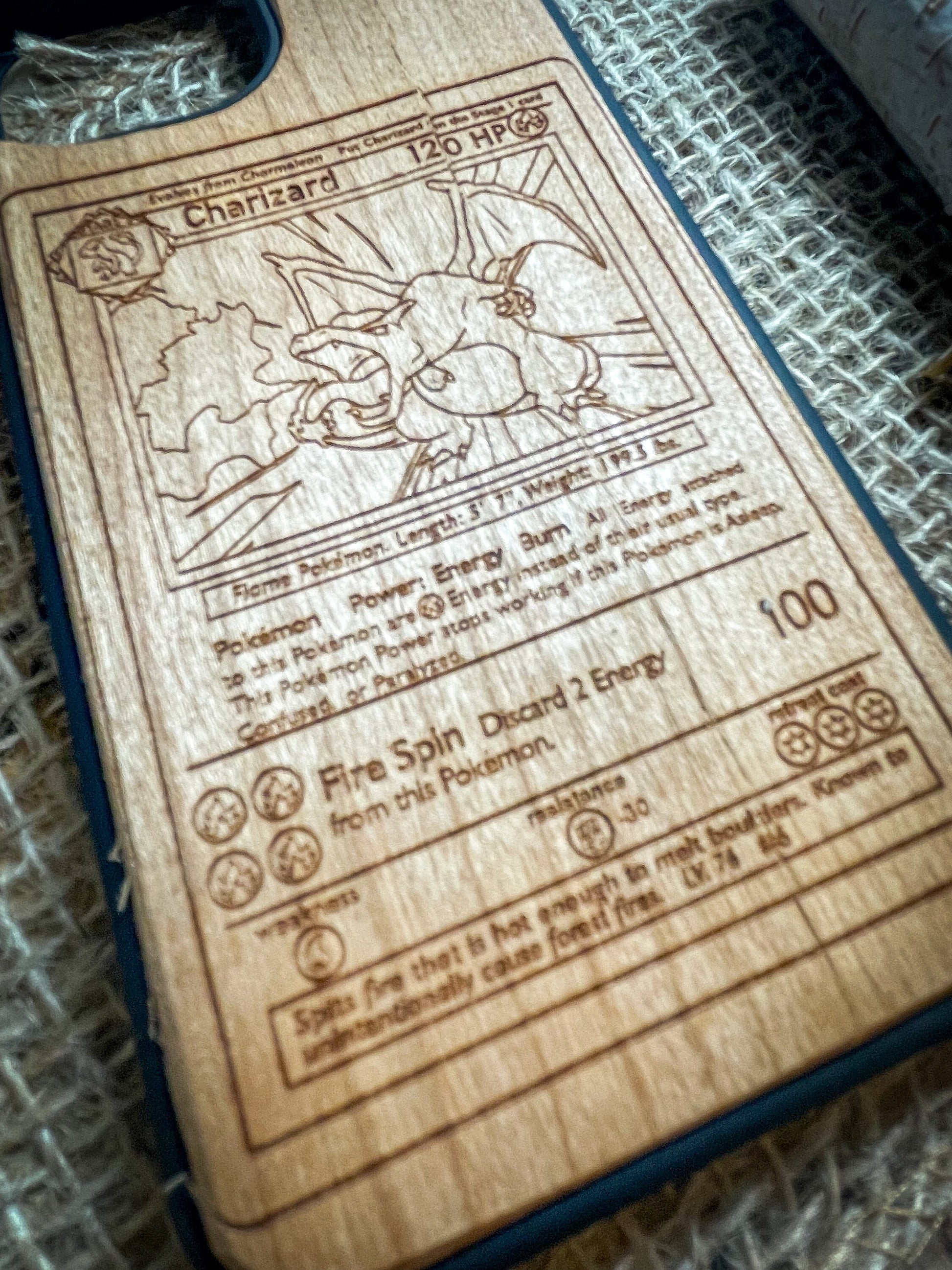 a wooden cutting board with a picture of pokemon on it