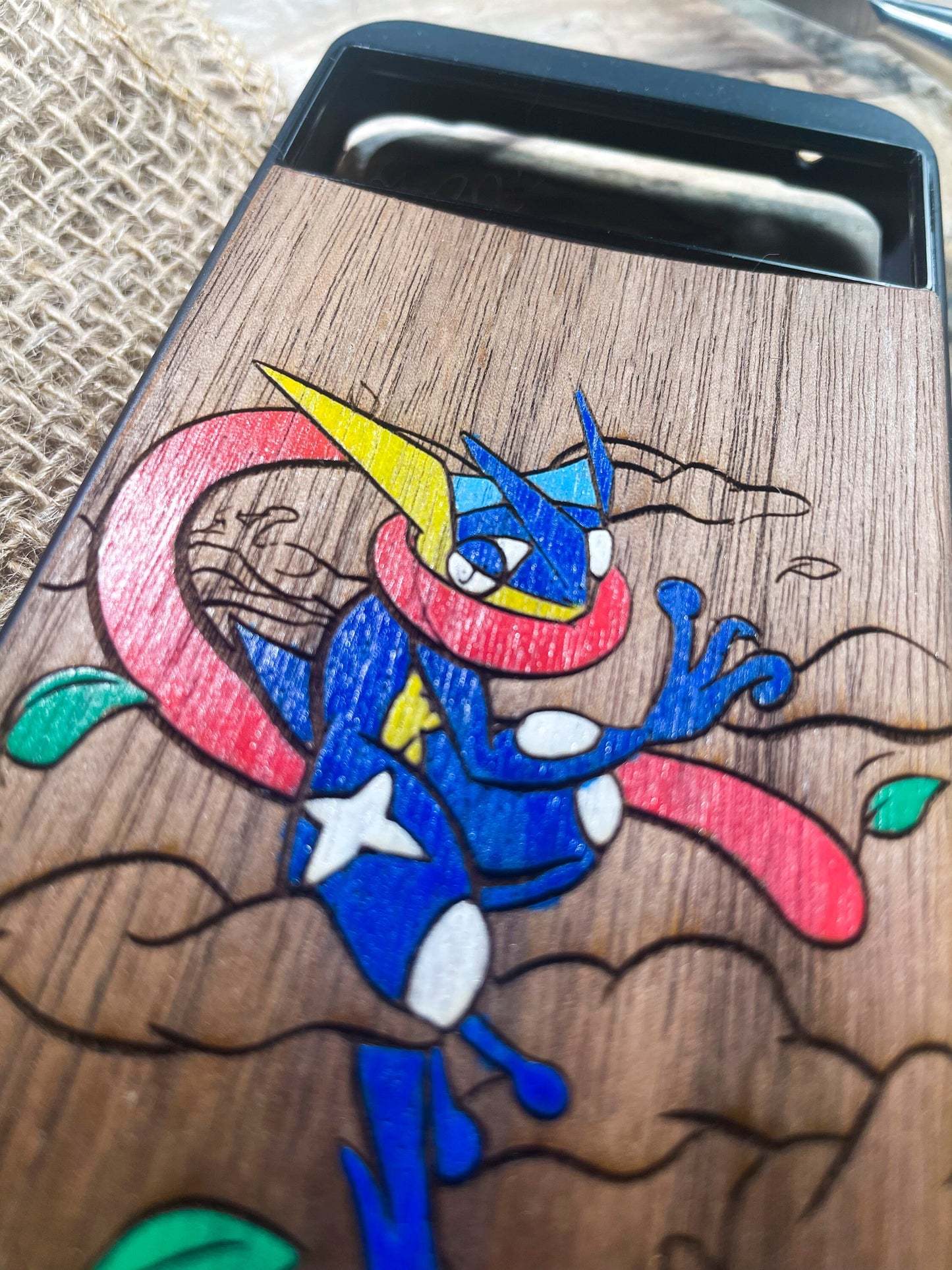 a close up of a wooden object with a drawing on it