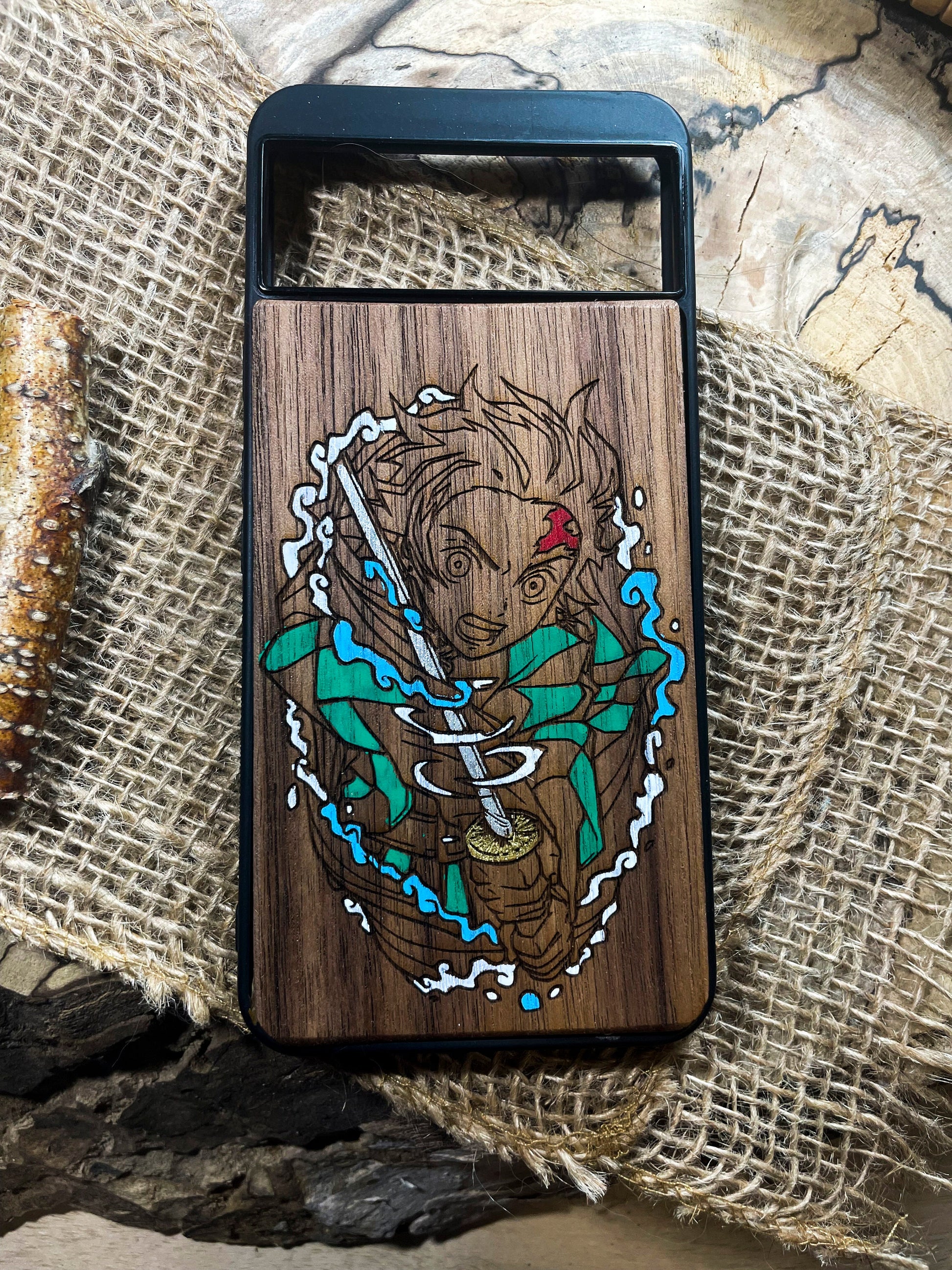 a wooden phone case with a picture of a bear on it