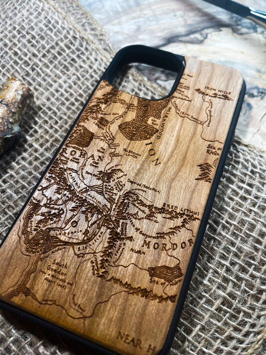 a wooden phone case with a map of the world on it