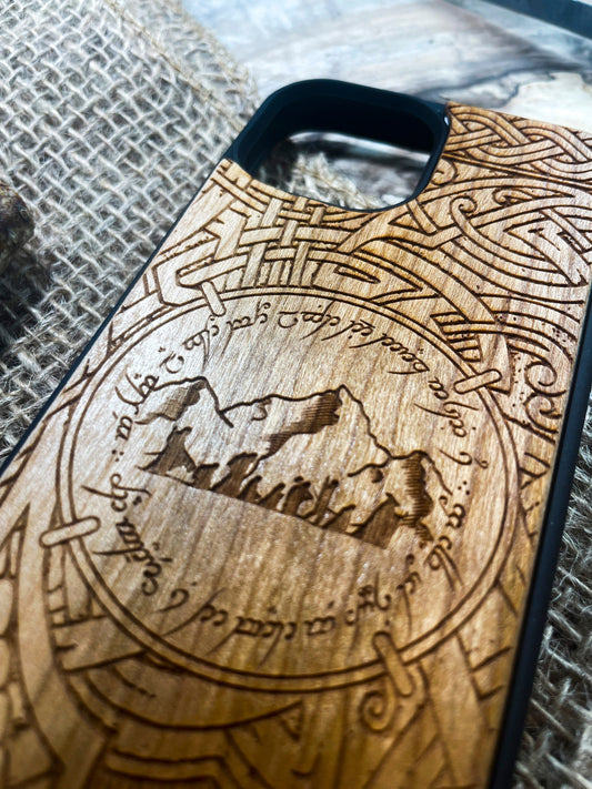 a wooden phone case with a picture of a mountain