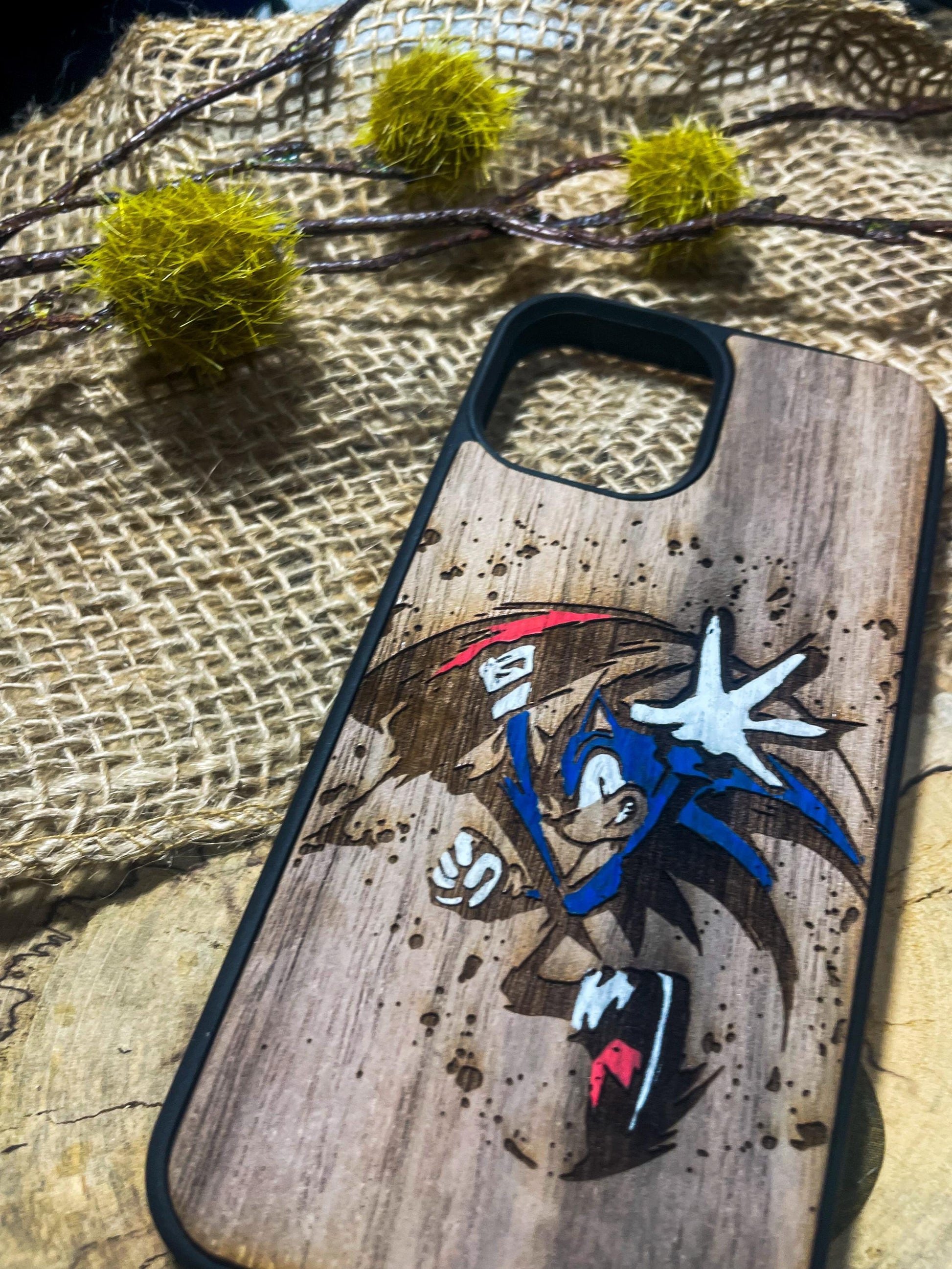 a wooden phone case with a picture of sonic the hedgehog on it