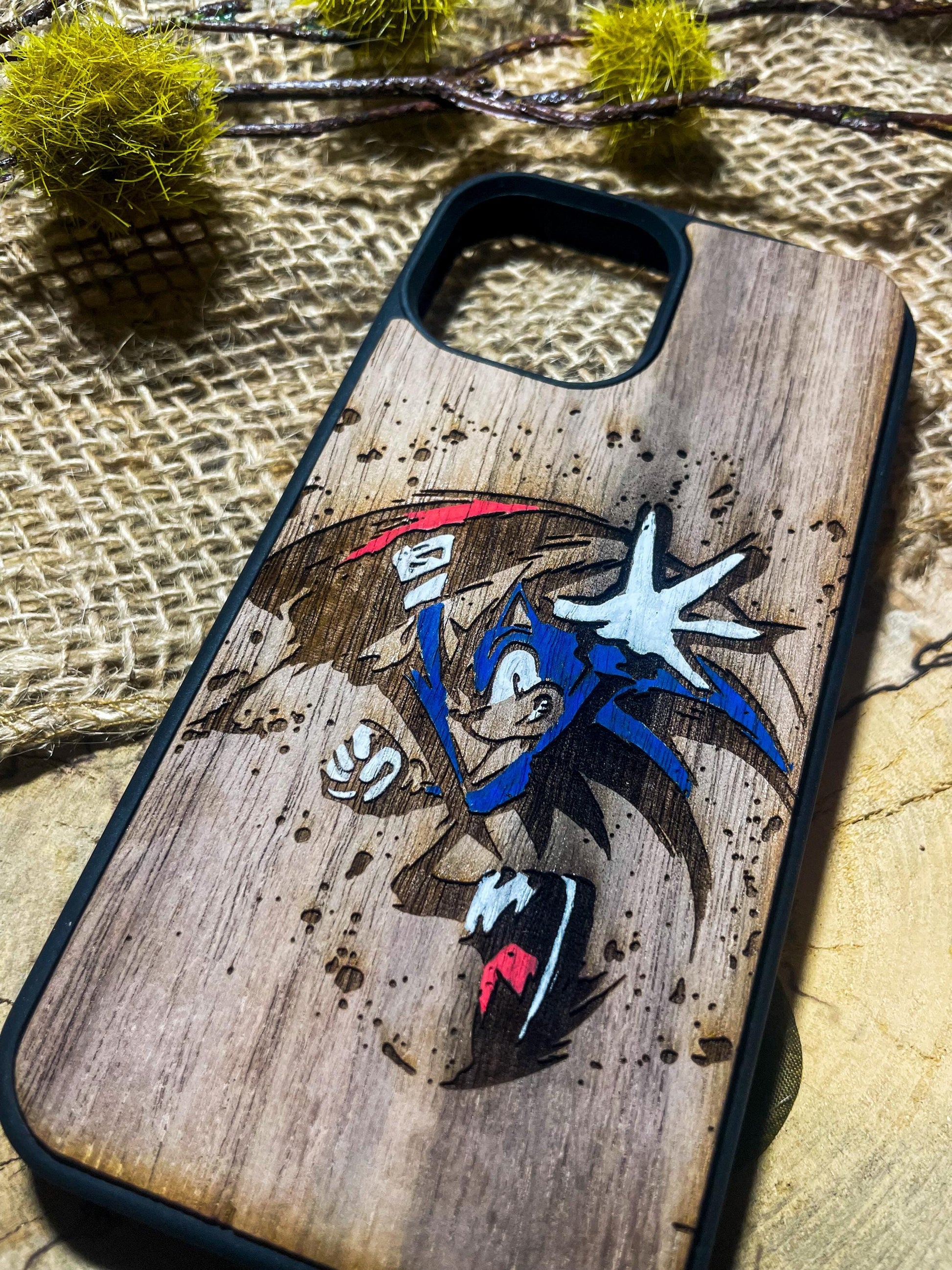 a wooden phone case with a picture of sonic the hedgehog on it