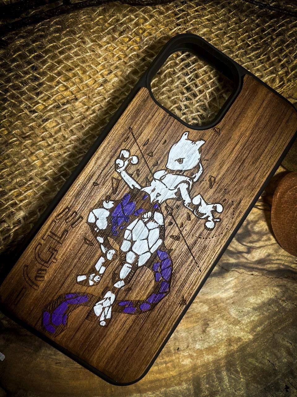 a wooden phone case with a picture of a cartoon character on it