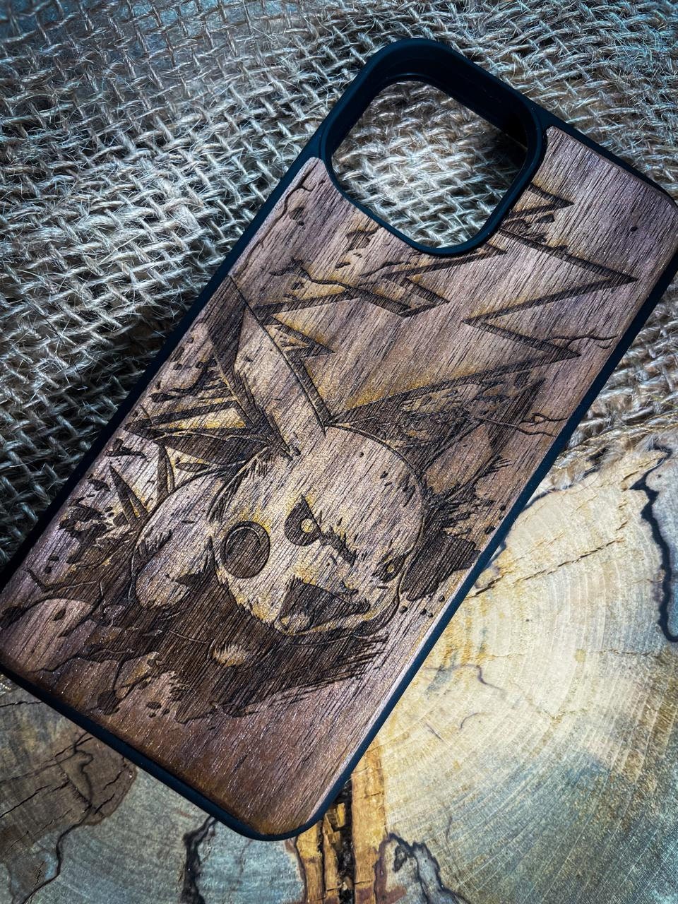 a wooden phone case with a picture of a skull on it