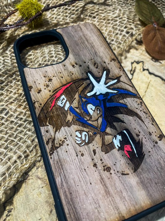 a wooden phone case with a picture of a bird on it