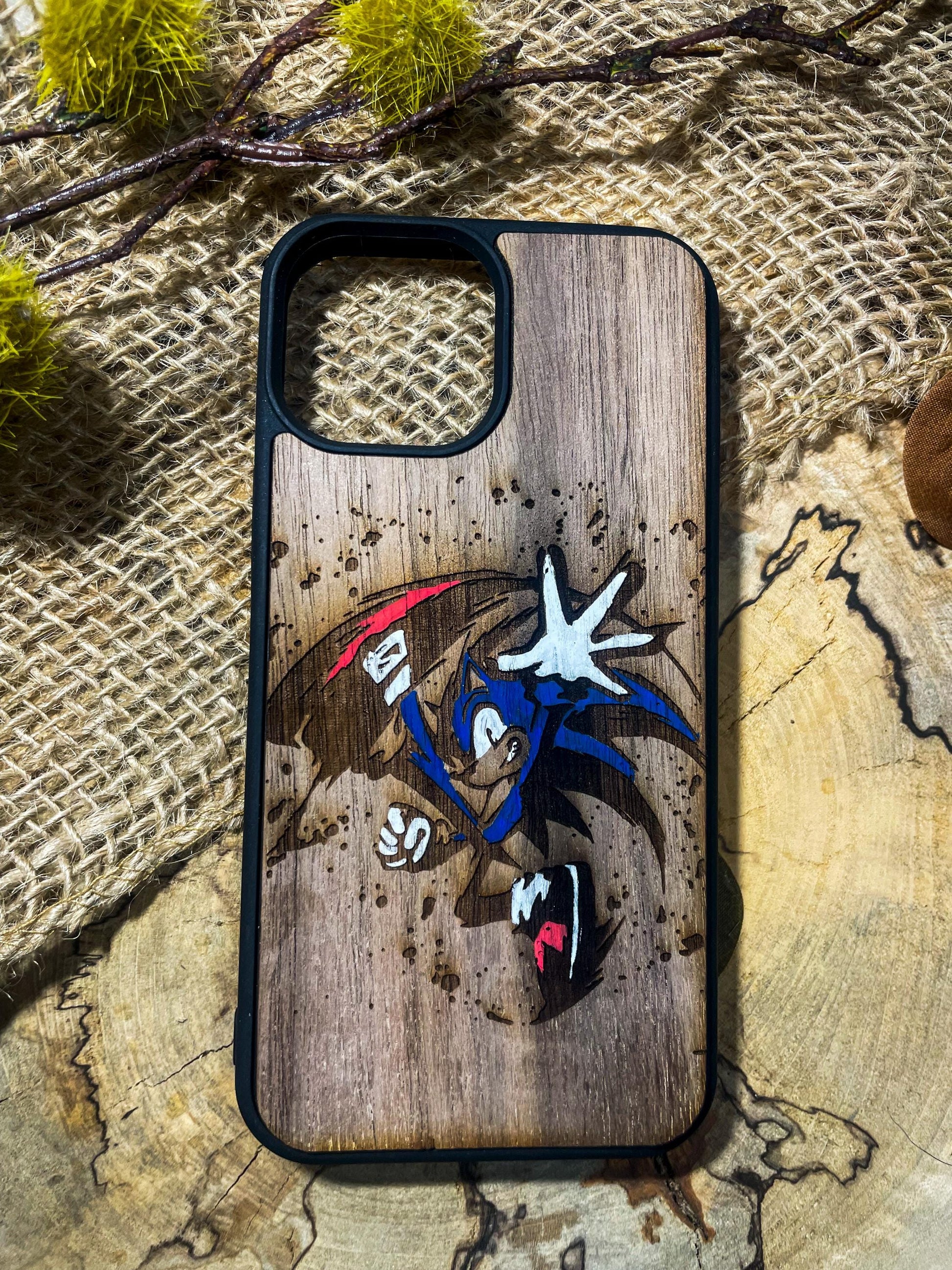 a wooden phone case with a picture of a cartoon character on it