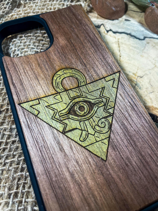 a wooden phone case with an all seeing eye on it