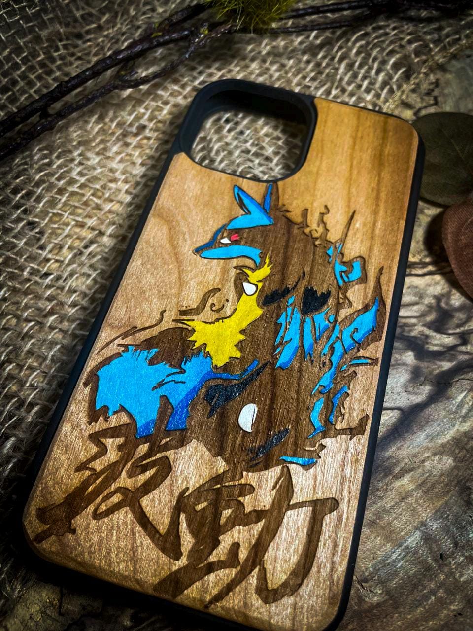 a wooden phone case with a picture of a pokemon on it